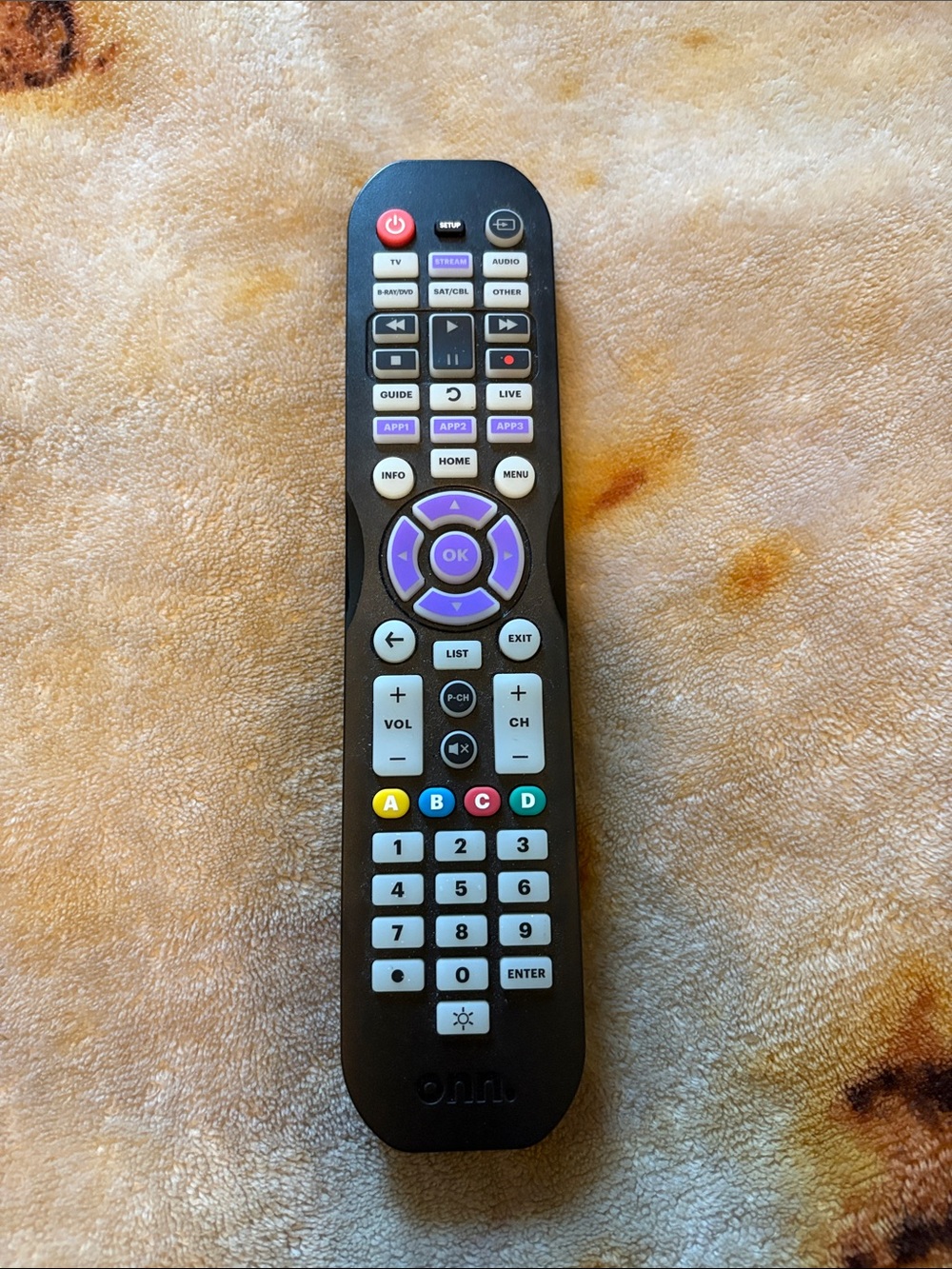 Black Remote Control with Purple Navigation for Media Streamers
